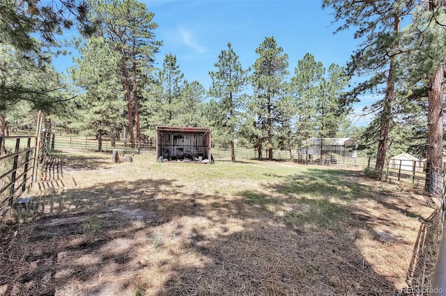 10771 Winding Meadow Dr, Kiowa, CO 80117 - view of yard featuring an outbuilding, a rural view, and an outdoor structure