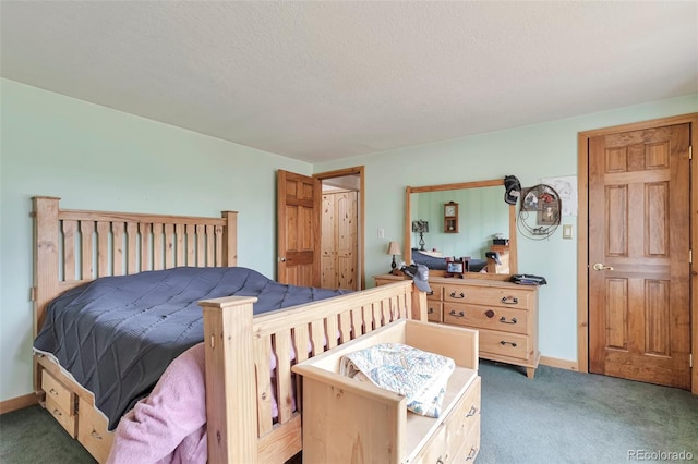 10771 Winding Meadow Dr, Kiowa, CO 80117 - bedroom featuring a textured ceiling, dark carpet, and baseboards
