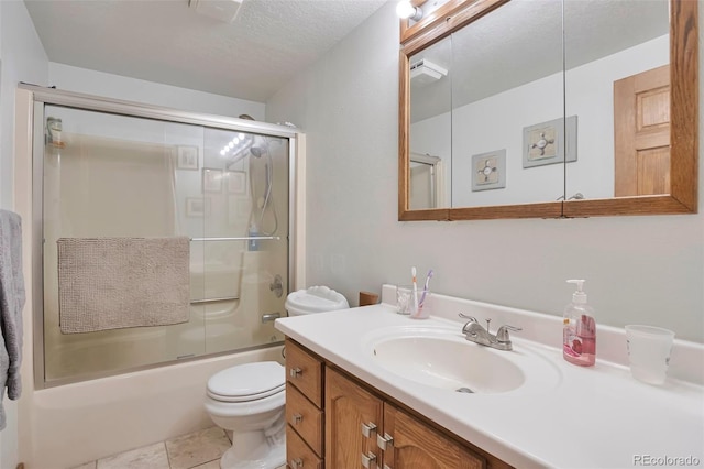 10771 Winding Meadow Dr, Kiowa, CO 80117 - bathroom featuring a textured ceiling, toilet, vanity, combined bath / shower with glass door, and tile patterned floors