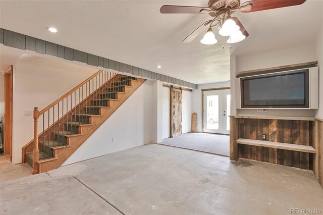 10771 Winding Meadow Dr, Kiowa, CO 80117 - living area with stairway, unfinished concrete flooring, and a ceiling fan