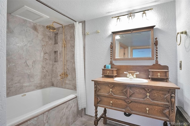 10771 Winding Meadow Dr, Kiowa, CO 80117 - bathroom featuring a textured wall, tiled shower / bath, a textured ceiling, and vanity