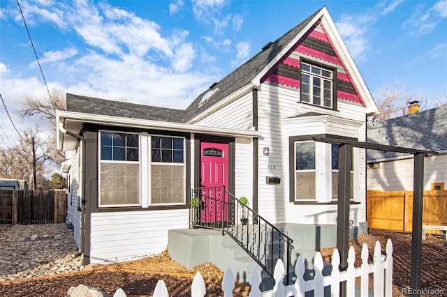 victorian-style house with fence