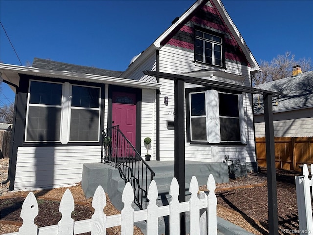 view of front of home featuring fence