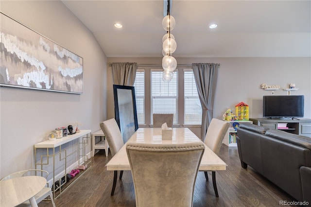 dining space with dark wood-type flooring and recessed lighting