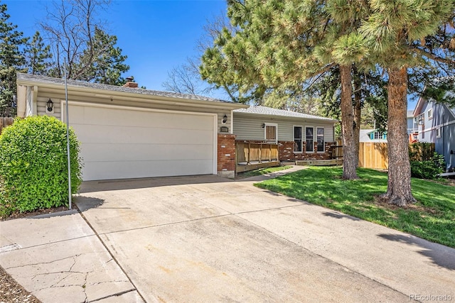 7773 Brentwood Ct, Arvada, CO 80005 - ranch-style home with brick siding, an attached garage, driveway, and a chimney