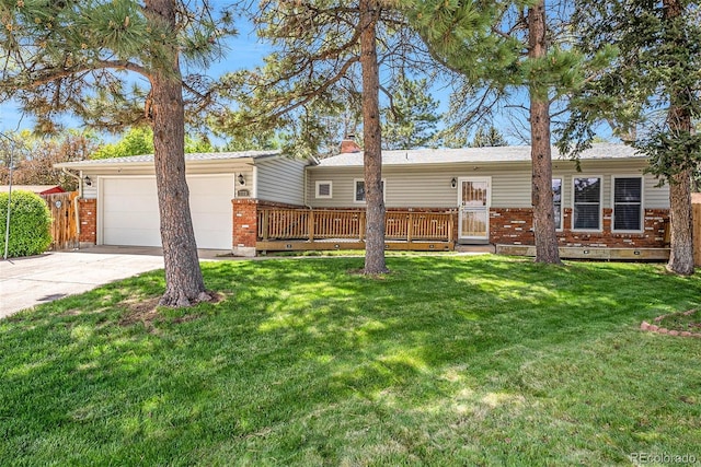 7773 Brentwood Ct, Arvada, CO 80005 - view of front facade featuring brick siding, concrete driveway, a garage, and crawl space
