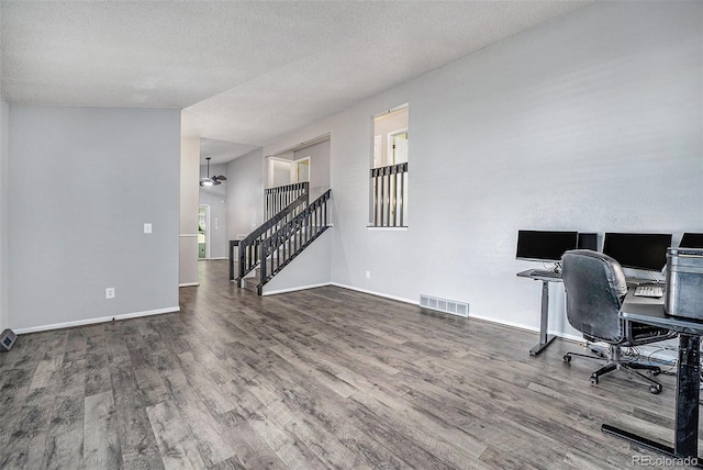 7773 Brentwood Ct, Arvada, CO 80005 - office featuring wood finished floors, a ceiling fan, baseboards, and a textured ceiling