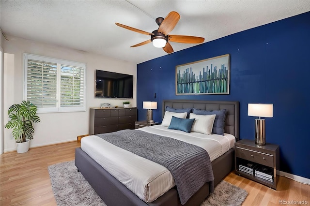 7773 Brentwood Ct, Arvada, CO 80005 - bedroom featuring light wood finished floors, baseboards, and a ceiling fan