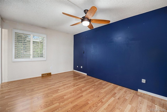 7773 Brentwood Ct, Arvada, CO 80005 - spare room with a ceiling fan, wood finished floors, and a textured ceiling