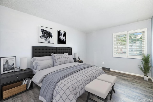 7773 Brentwood Ct, Arvada, CO 80005 - bedroom with wood finished floors and baseboards