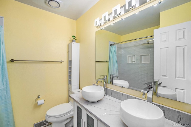 7773 Brentwood Ct, Arvada, CO 80005 - bathroom with toilet, curtained shower, and double vanity