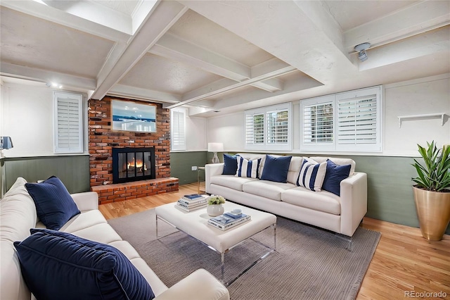 7773 Brentwood Ct, Arvada, CO 80005 - living area with wood finished floors, a fireplace, coffered ceiling, and beamed ceiling