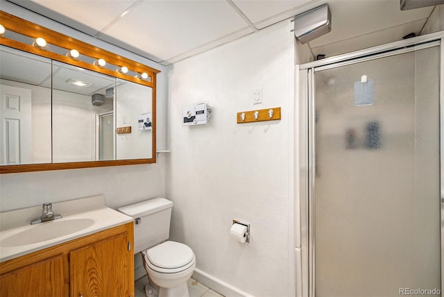 7773 Brentwood Ct, Arvada, CO 80005 - full bath featuring a shower stall, toilet, vanity, and tile patterned flooring