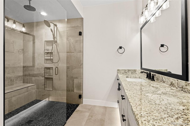 bathroom with vanity, walk in shower, and tile patterned floors