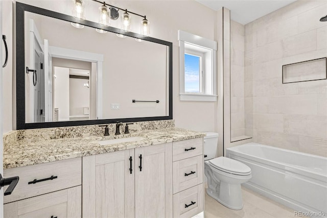 full bathroom with vanity, toilet, tiled shower / bath, and tile patterned flooring