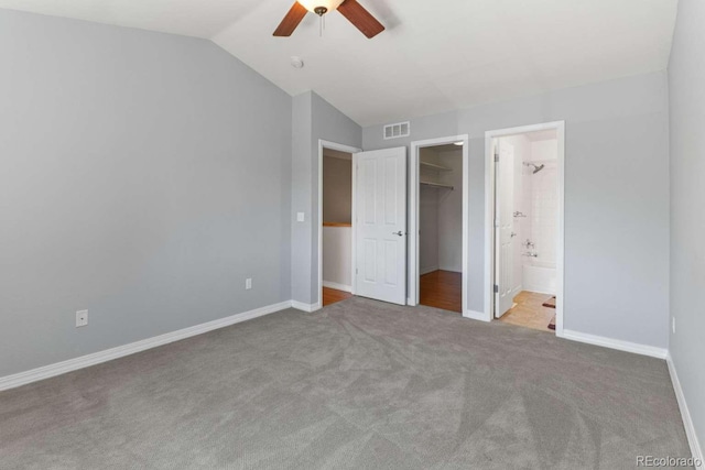 13231 Holly St Unit B, Thornton, CO 80241 - unfurnished bedroom featuring carpet flooring, a spacious closet, vaulted ceiling, a closet, and ceiling fan