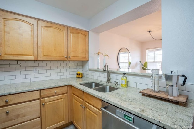 13231 Holly St Unit B, Thornton, CO 80241 - kitchen featuring tasteful backsplash, stainless steel dishwasher, light brown cabinetry, and light stone countertops