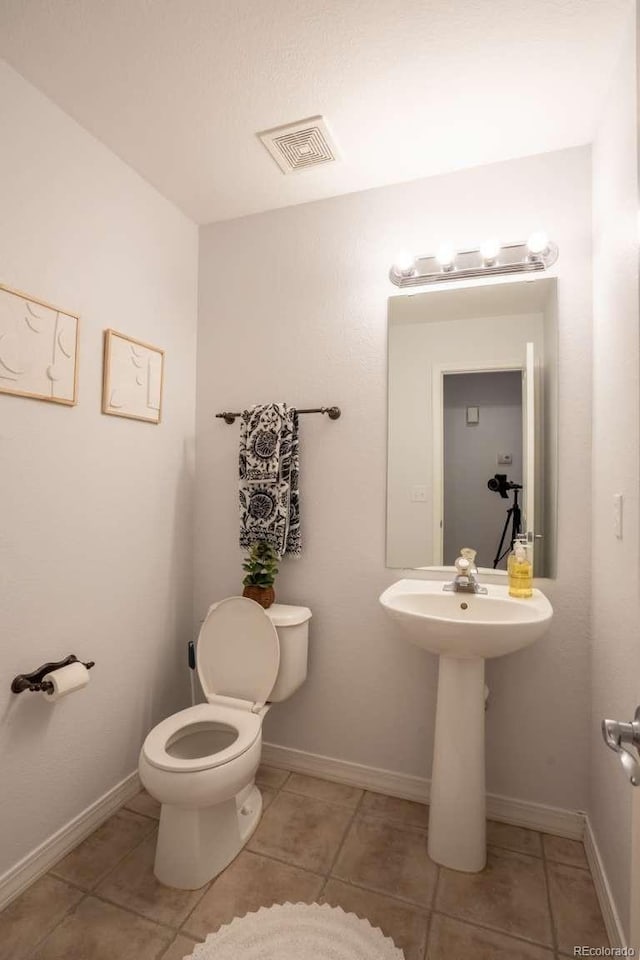 13231 Holly St Unit B, Thornton, CO 80241 - half bathroom featuring tile patterned flooring