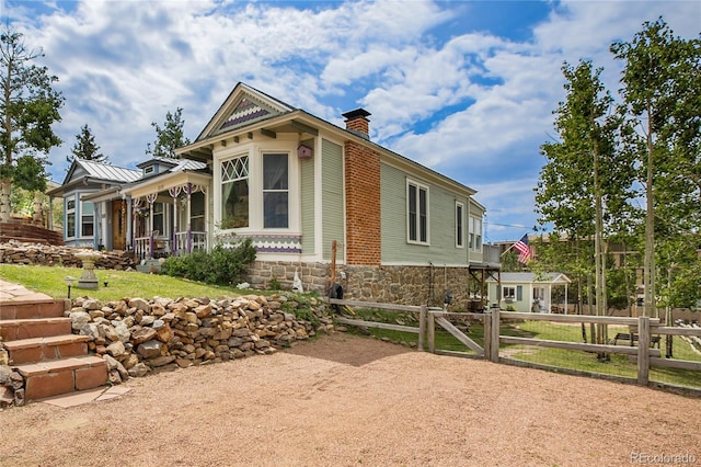 220 E Eaton Ave, Cripple Creek, CO 80813 - view of front facade with a chimney