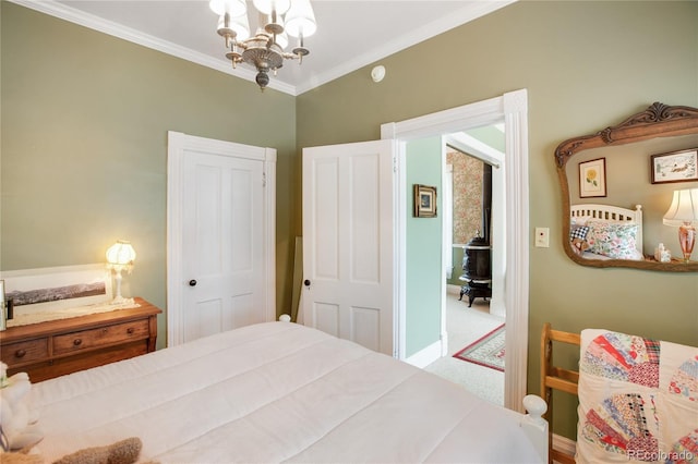 220 E Eaton Ave, Cripple Creek, CO 80813 - bedroom featuring a chandelier, ornamental molding, carpet floors, and baseboards