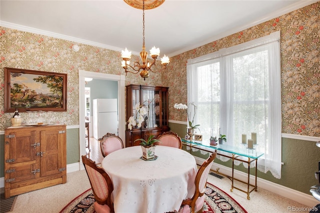 220 E Eaton Ave, Cripple Creek, CO 80813 - carpeted dining space featuring wallpapered walls, a chandelier, and ornamental molding