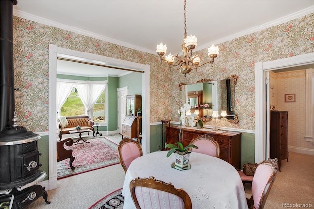 220 E Eaton Ave, Cripple Creek, CO 80813 - dining room featuring carpet floors, a chandelier, wallpapered walls, a wood stove, and crown molding