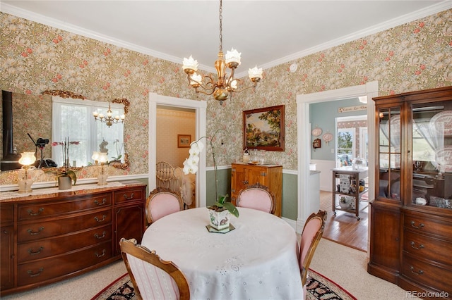 220 E Eaton Ave, Cripple Creek, CO 80813 - dining area featuring a chandelier, wainscoting, wallpapered walls, and crown molding