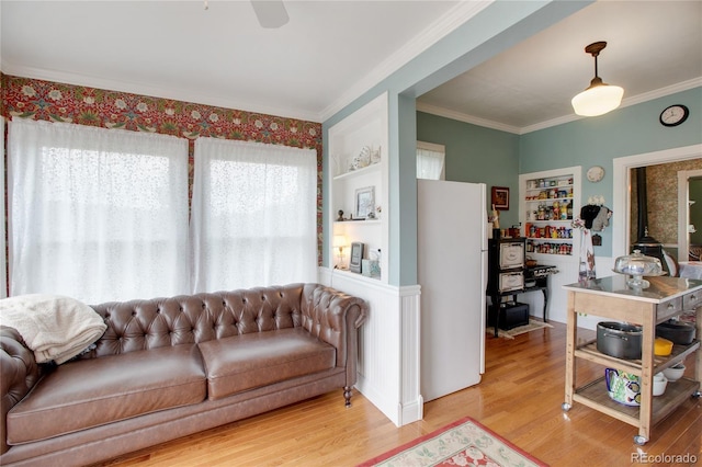 220 E Eaton Ave, Cripple Creek, CO 80813 - living room with wood finished floors, crown molding, and ceiling fan