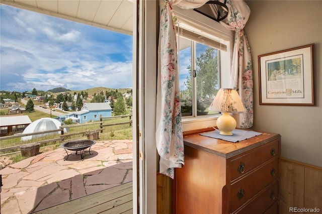 220 E Eaton Ave, Cripple Creek, CO 80813 - detailed view of a fire pit, a mountain backdrop, and wainscoting