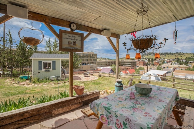 220 E Eaton Ave, Cripple Creek, CO 80813 - view of patio / terrace with an outbuilding and outdoor dining space