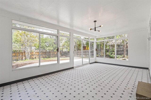 423 Nile St, Aurora, CO 80010 - unfurnished sunroom with a chandelier, healthy amount of natural light, and ceiling fan