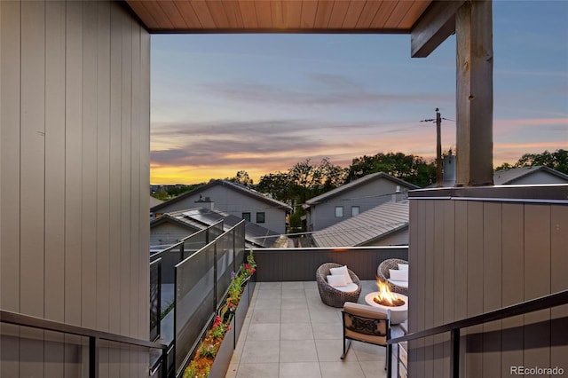 balcony at dusk with an outdoor fire pit