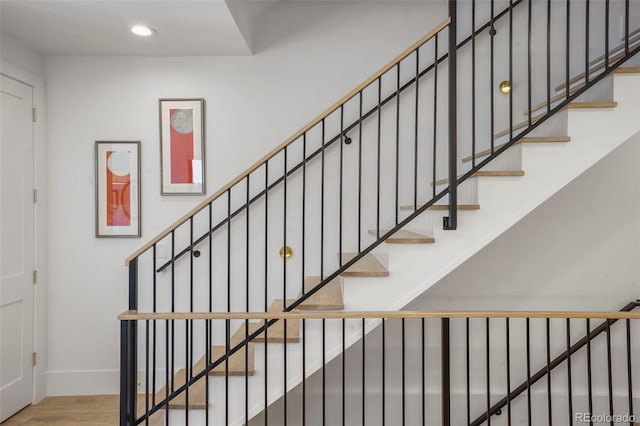 stairs with hardwood / wood-style floors