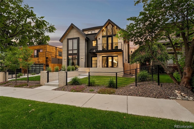 view of front of home featuring a balcony