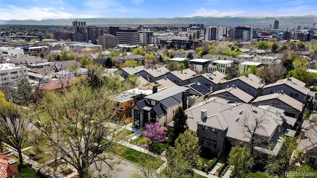 birds eye view of property with a mountain view