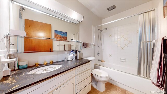 775 S Alton Way Unit 3D, Denver, CO 80247 - bathroom featuring toilet, vanity, shower / bath combination, and wood finished floors