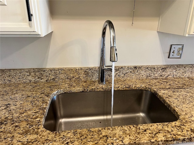 775 S Alton Way Unit 3D, Denver, CO 80247 - kitchen view of a sink, white cabinetry, and light stone counters