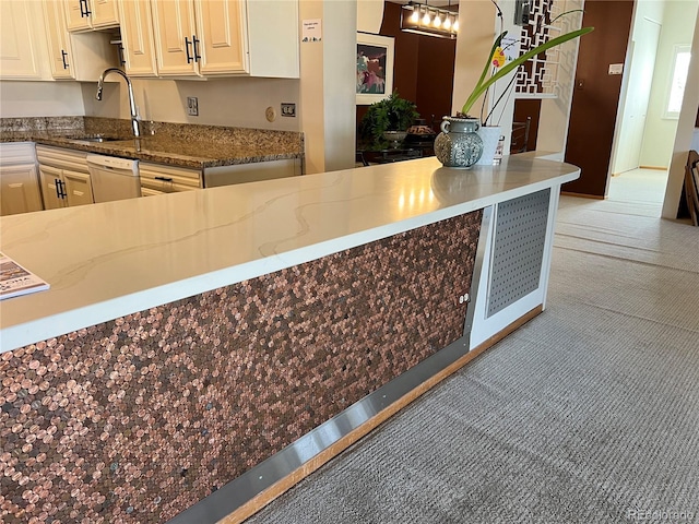 775 S Alton Way Unit 3D, Denver, CO 80247 - kitchen with a sink, light carpet, dishwashing machine, and stone counters