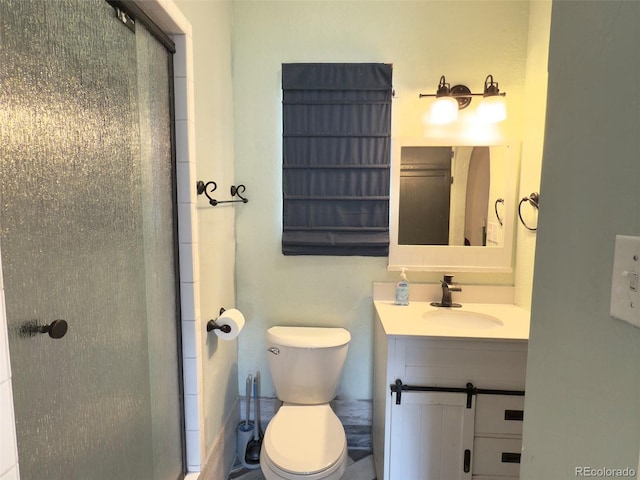 bathroom featuring toilet and vanity