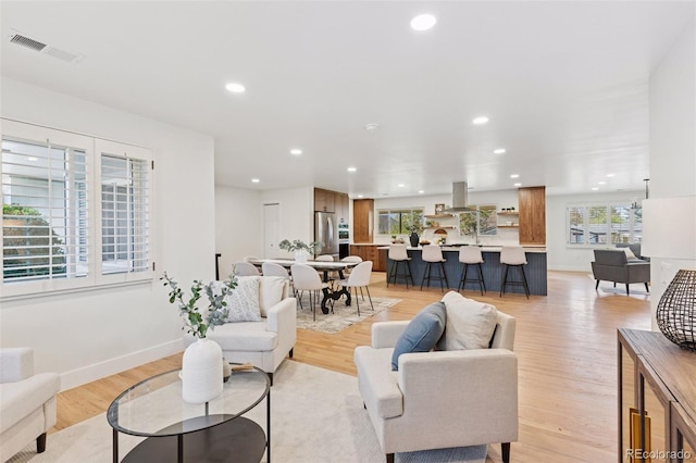 3775 S Forest Way, Denver, CO 80237 - living room with recessed lighting, light wood-type flooring, and baseboards
