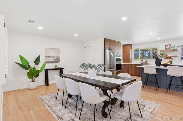 3775 S Forest Way, Denver, CO 80237 - dining space featuring light wood finished floors and recessed lighting