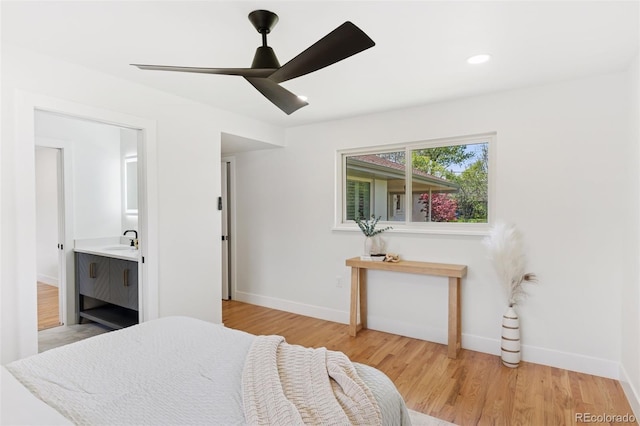3775 S Forest Way, Denver, CO 80237 - bedroom with a sink, baseboards, light wood-type flooring, connected bathroom, and ceiling fan