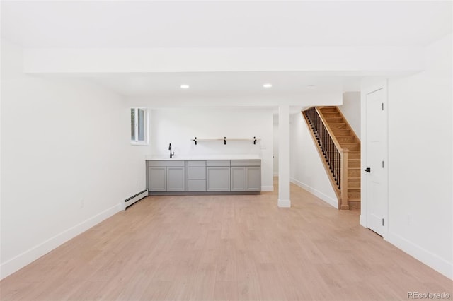 3775 S Forest Way, Denver, CO 80237 - unfurnished living room featuring a baseboard heating unit, stairway, recessed lighting, light wood-type flooring, and baseboards