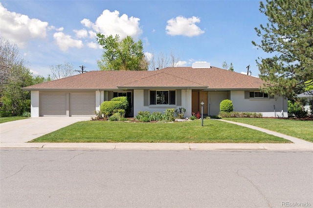 3775 S Forest Way, Denver, CO 80237 - ranch-style house with concrete driveway, a garage, a front yard, and stucco siding