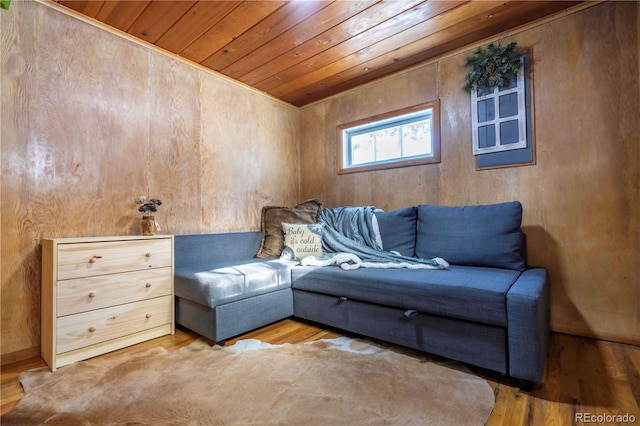 sitting room with hardwood / wood-style floors and wood ceiling