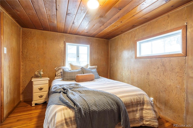 296 Anderson Rd, Bailey, CO 80421 - bedroom with multiple windows, wooden ceiling, wood finished floors, french doors, and baseboards