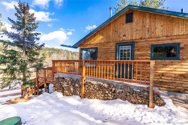 296 Anderson Rd, Bailey, CO 80421 - view of snowy exterior with a wooden deck