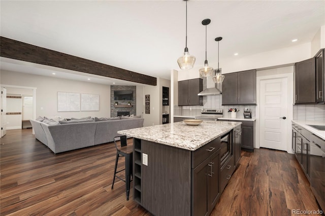 719 Saddle Ridge Cir, Granby, CO 80446 - kitchen with stainless steel range with electric stovetop, dark brown cabinets, decorative backsplash, recessed lighting, and dark wood-type flooring