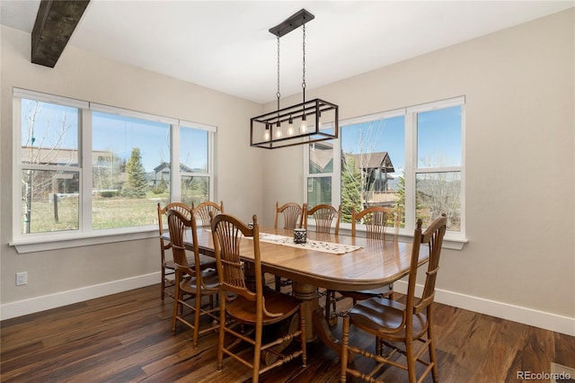 719 Saddle Ridge Cir, Granby, CO 80446 - dining room with baseboards and dark wood-type flooring