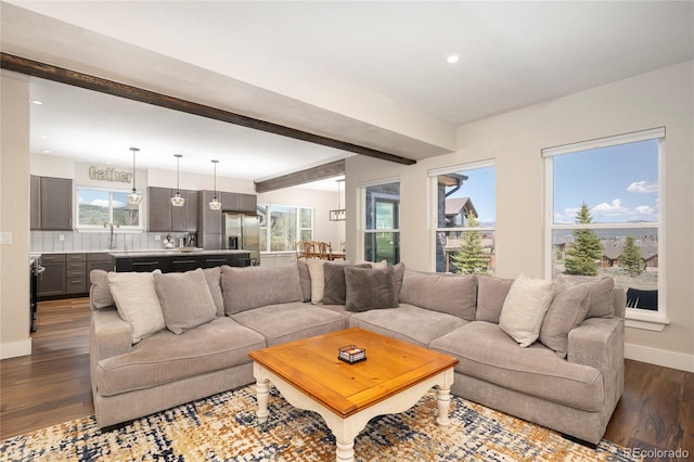 719 Saddle Ridge Cir, Granby, CO 80446 - living area with dark wood-style flooring, beamed ceiling, baseboards, and recessed lighting
